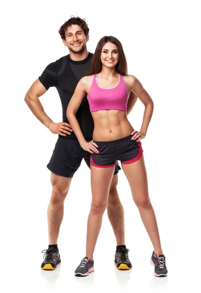 Спортивная(ый) пара - мужчина и женщина после Фитнес упражнения на белом — стоковое фото