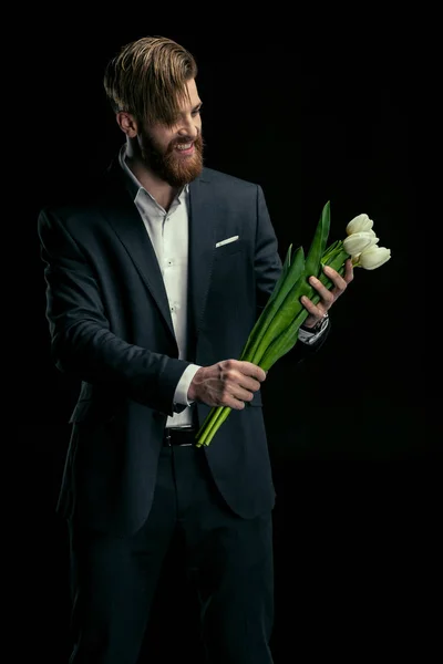 Стильный человек с тюльпанами — стоковое фото