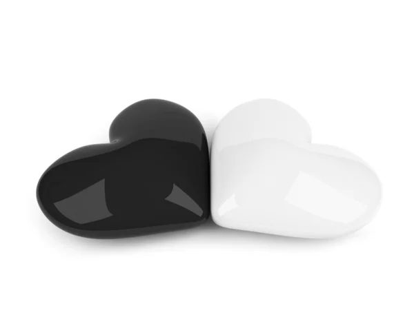 Черно-белые сердца, лежа над белой — стоковое фото